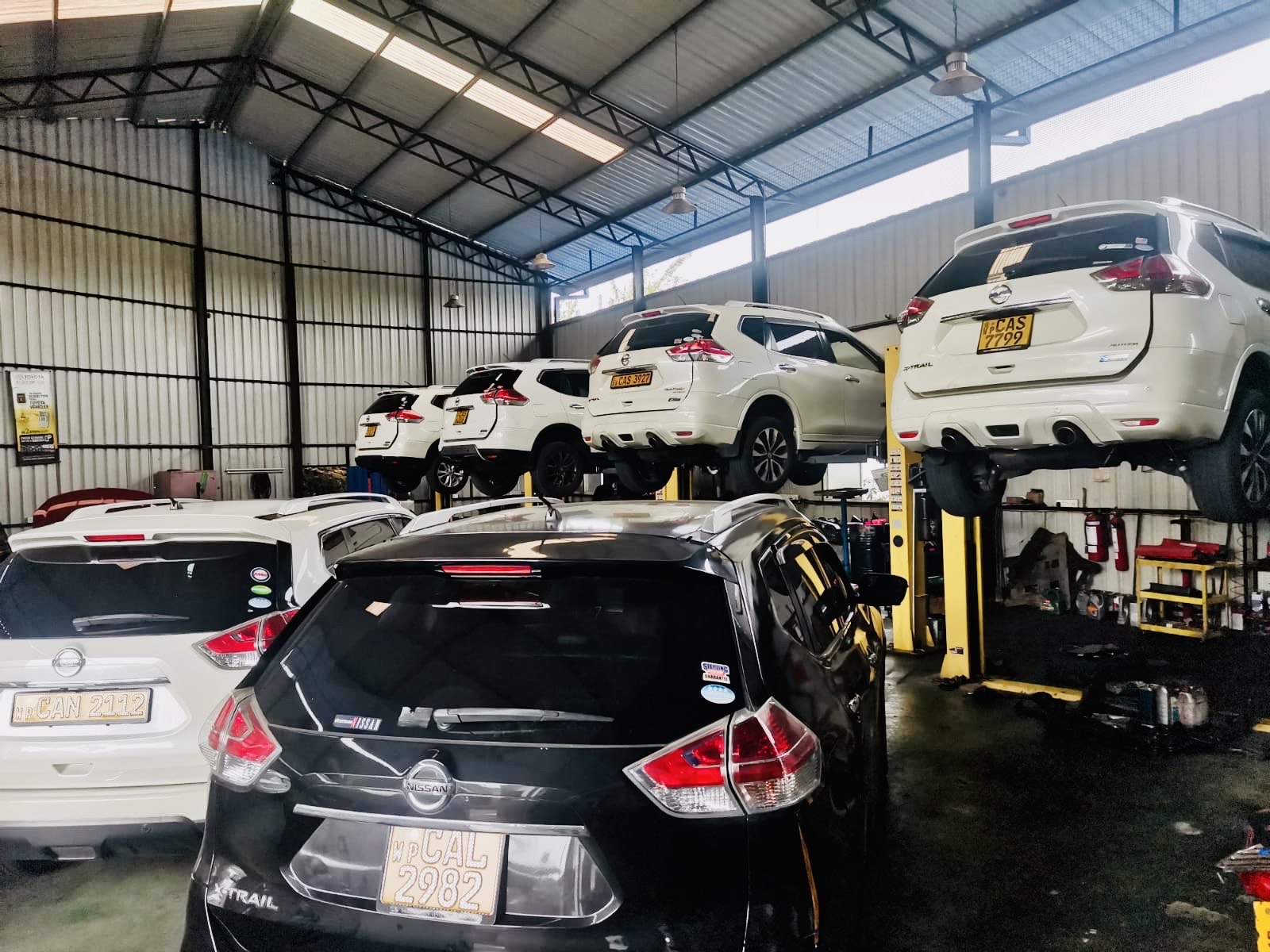 Expert technicians servicing vehicles in our workshop