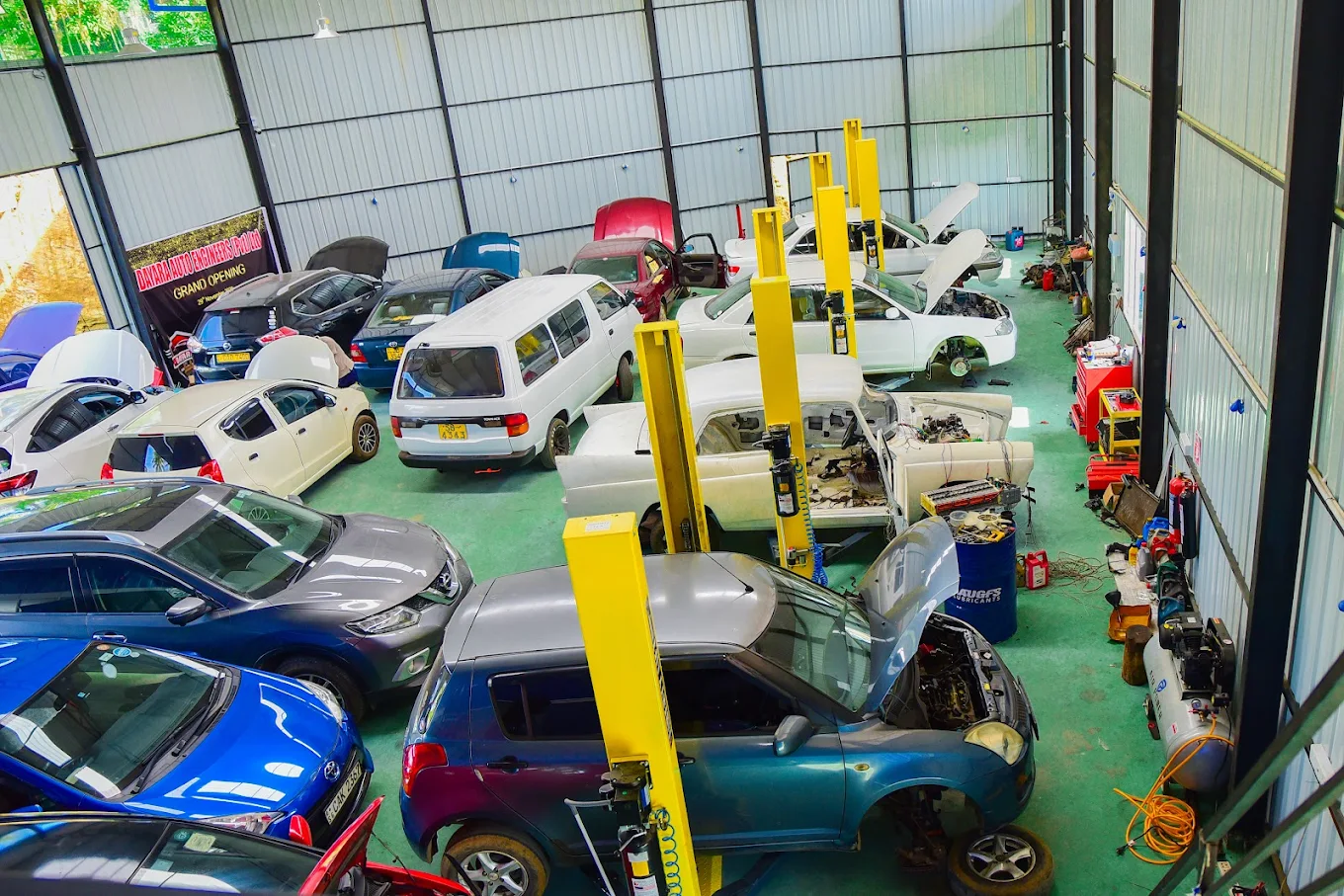 Spacious workshop with multiple hydraulic lifts and service bays